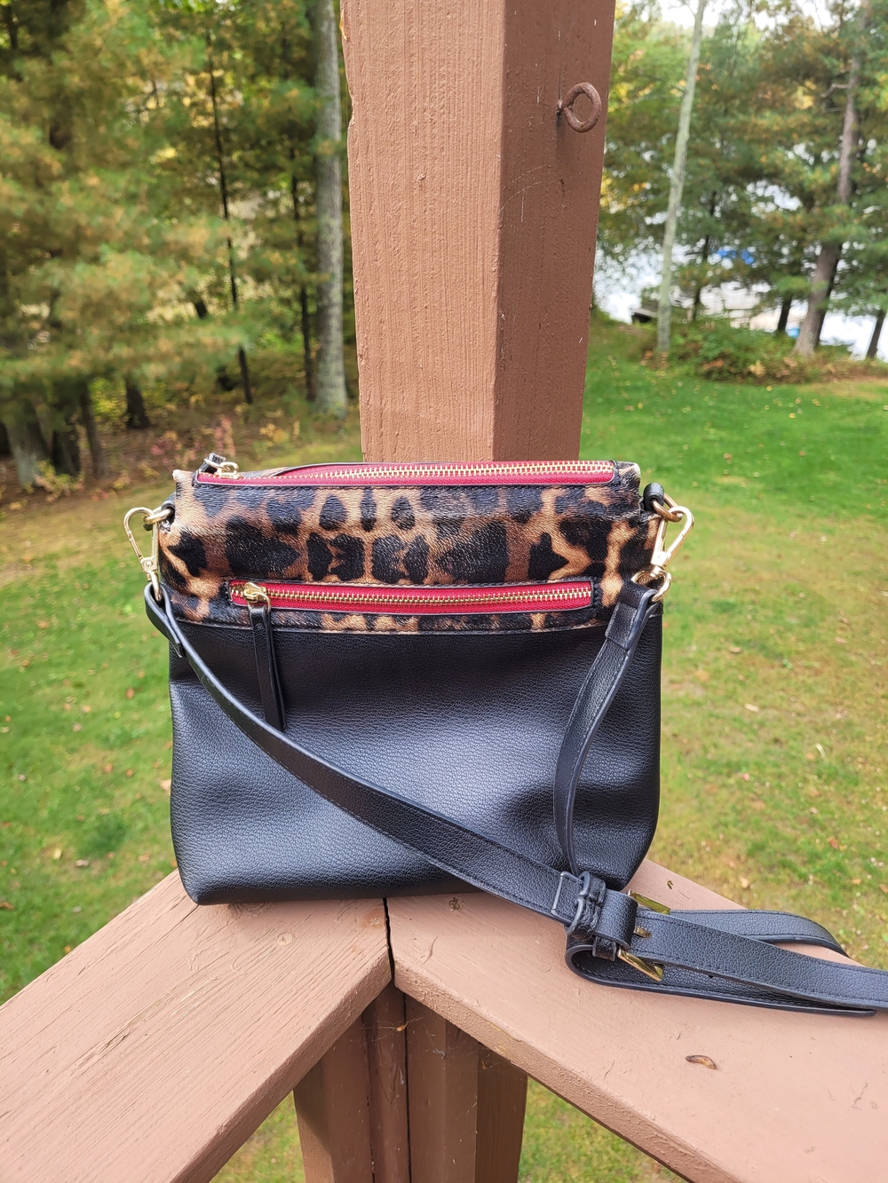 Sondra Roberts Black Crossbody Bag with Leopard Accent and Red Zippers